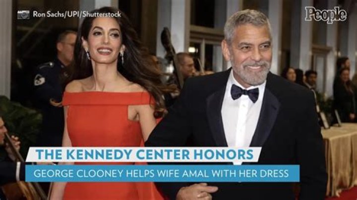 
George Clooney Fixes Wife Amal’s Dress Train While on Kennedy Center Honors Red Carpet 